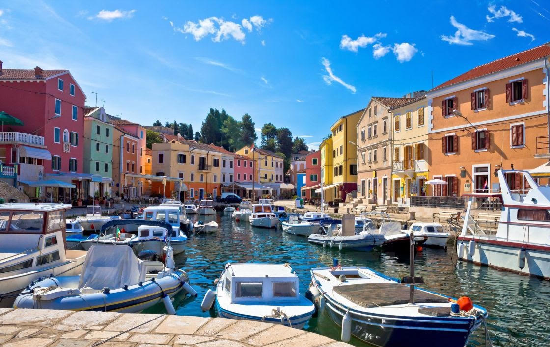 Colourful harbour houses and boats in Veli Lošinj